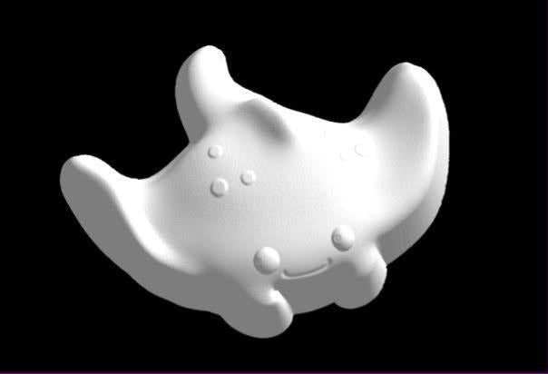 Cute manta ray mold with upswept wing tips, small horn fins, a smiling face and a spotted back.