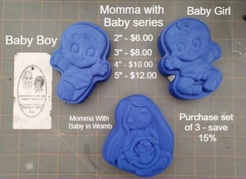 Cast mold of a mother with long hair cradling a curled baby against her belly