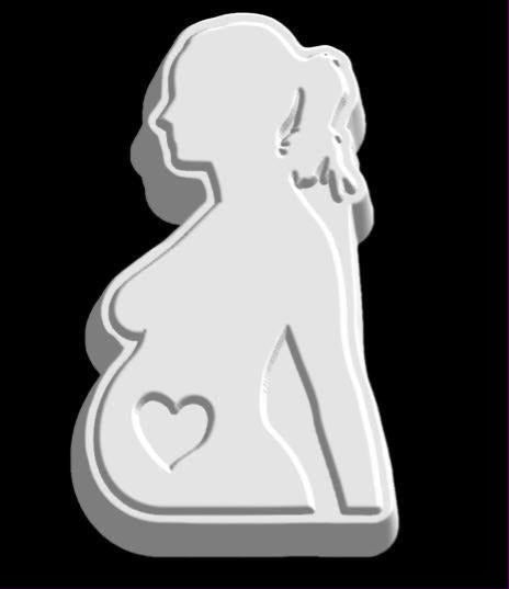 Silhouette mold of a pregnant woman in profile with hair in a bun and a heart cut through her belly.