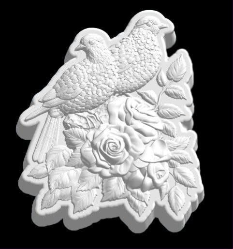 Cast plaque mold of two doves perched on a branch above a spray of open roses and leaves