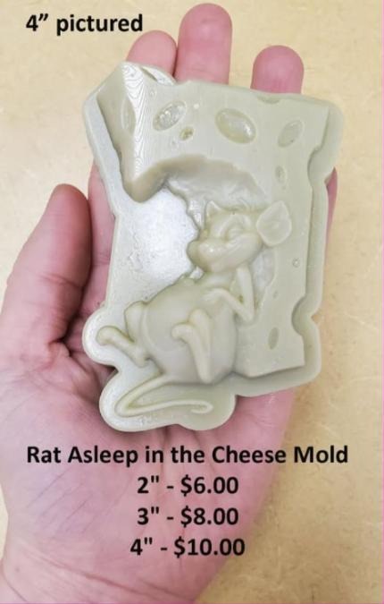 Cast of a Swiss cheese wedge full of holes with a mouse curled asleep at its base.