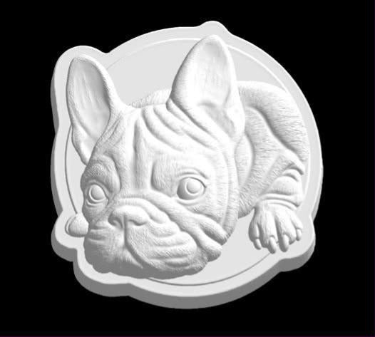 Cast mold of a French bulldog resting its wrinkled face on its paws with large bat ears