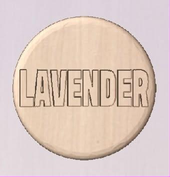Round shower tablet mold with LAVENDER in outlined block capitals across the face.