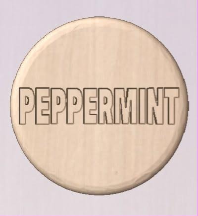 Round shower tablet mold with PEPPERMINT in outlined block capitals across the face.