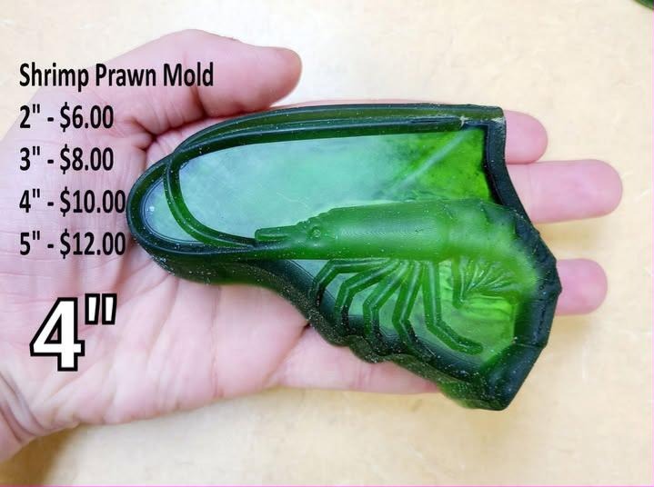 Shrimp mold, a curled prawn with a fanned tail, overlapping shell segments and trailing antennae.