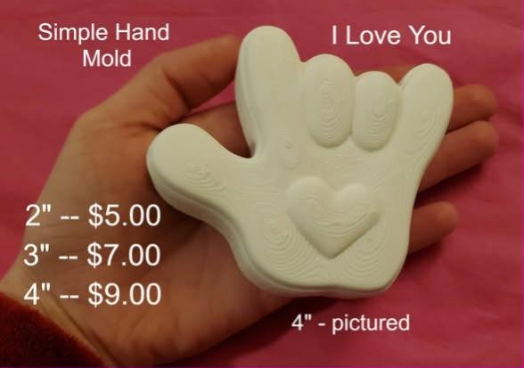 Cream cast hand making the I love you sign with a heart set into the palm