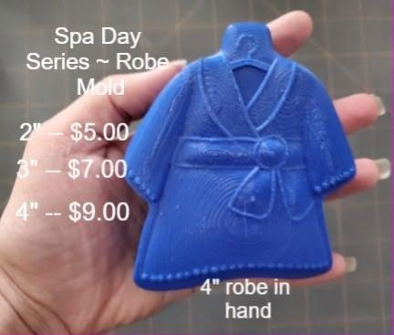 Blue cast of a wrap bathrobe with a shawl collar and knotted tie belt, held in a hand
