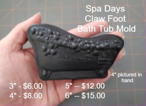 Black 3D printed claw foot bath tub mold held in a hand, with bubbles spilling over the rim.