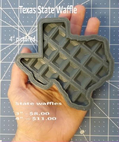 Grey mold in the shape of Texas filled with a square waffle grid, held in a hand
