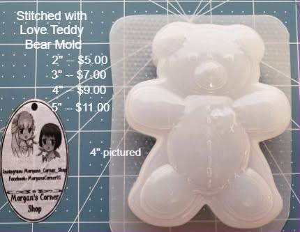 Clear plastic teddy bear mold with arms and legs out, round ears and a seamed tummy