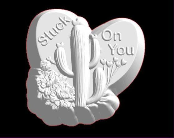 Heart plaque mold with a saguaro cactus, blossoms and Stuck On You lettered across the two lobes.