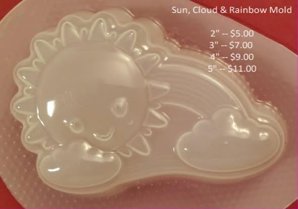 Clear plastic mold of a smiling sun with a rainbow arc curving into a small cloud.