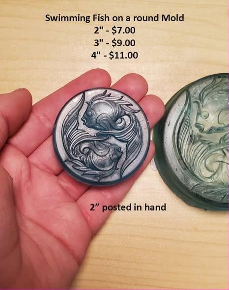 Round disc mold with two fish circling nose to tail, cast in grey with silver dry-brushed fins.
