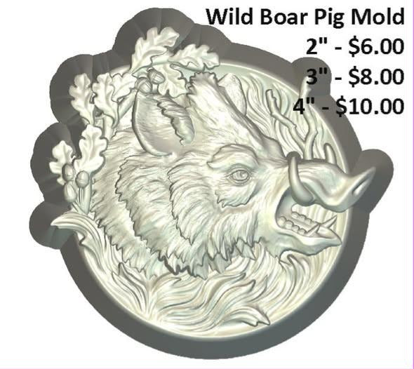 Round medallion mold with a tusked wild boar head framed by oak leaves and acorns.