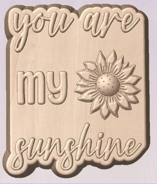 Wood tone cast plaque mold lettered you are my sunshine with a raised sunflower.